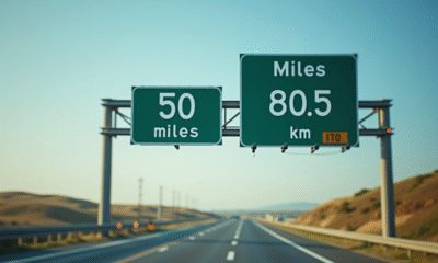 Panneau routier indiquant 50 miles et 80,5 km en plein jour